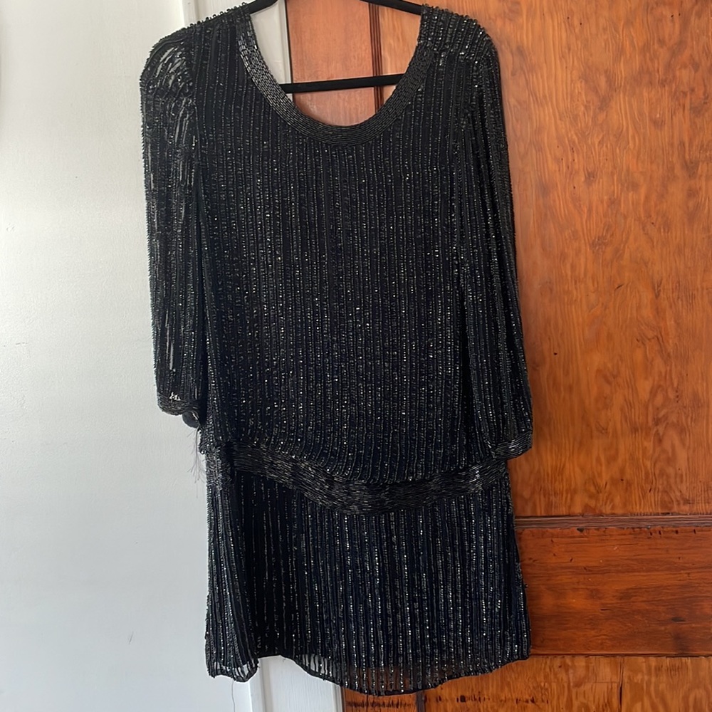 Parker hand beaded blouson dress. Rip on side